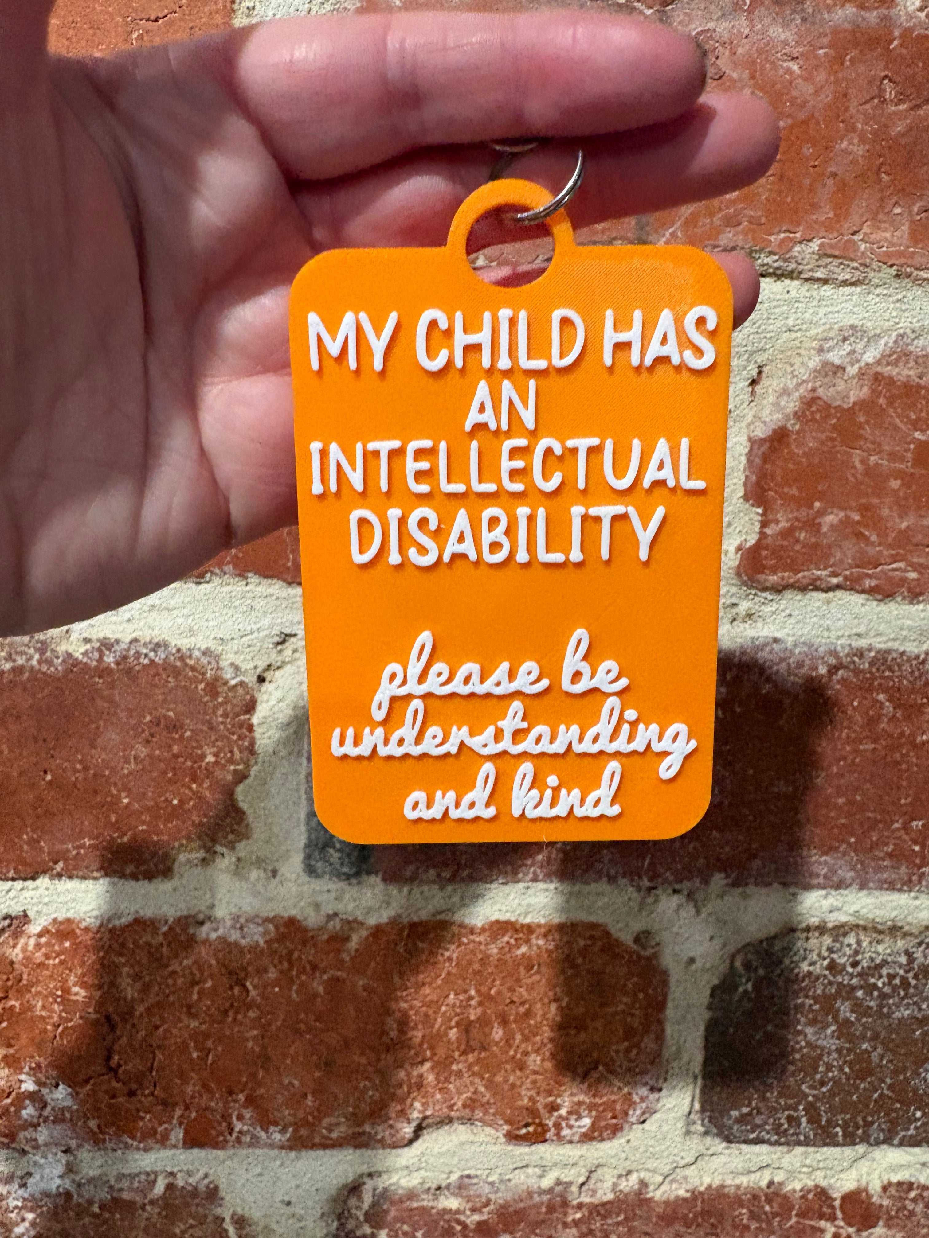 'My Child Has an Intellectual Disability' Talkies Awareness Tag - Coloured Background with White Text