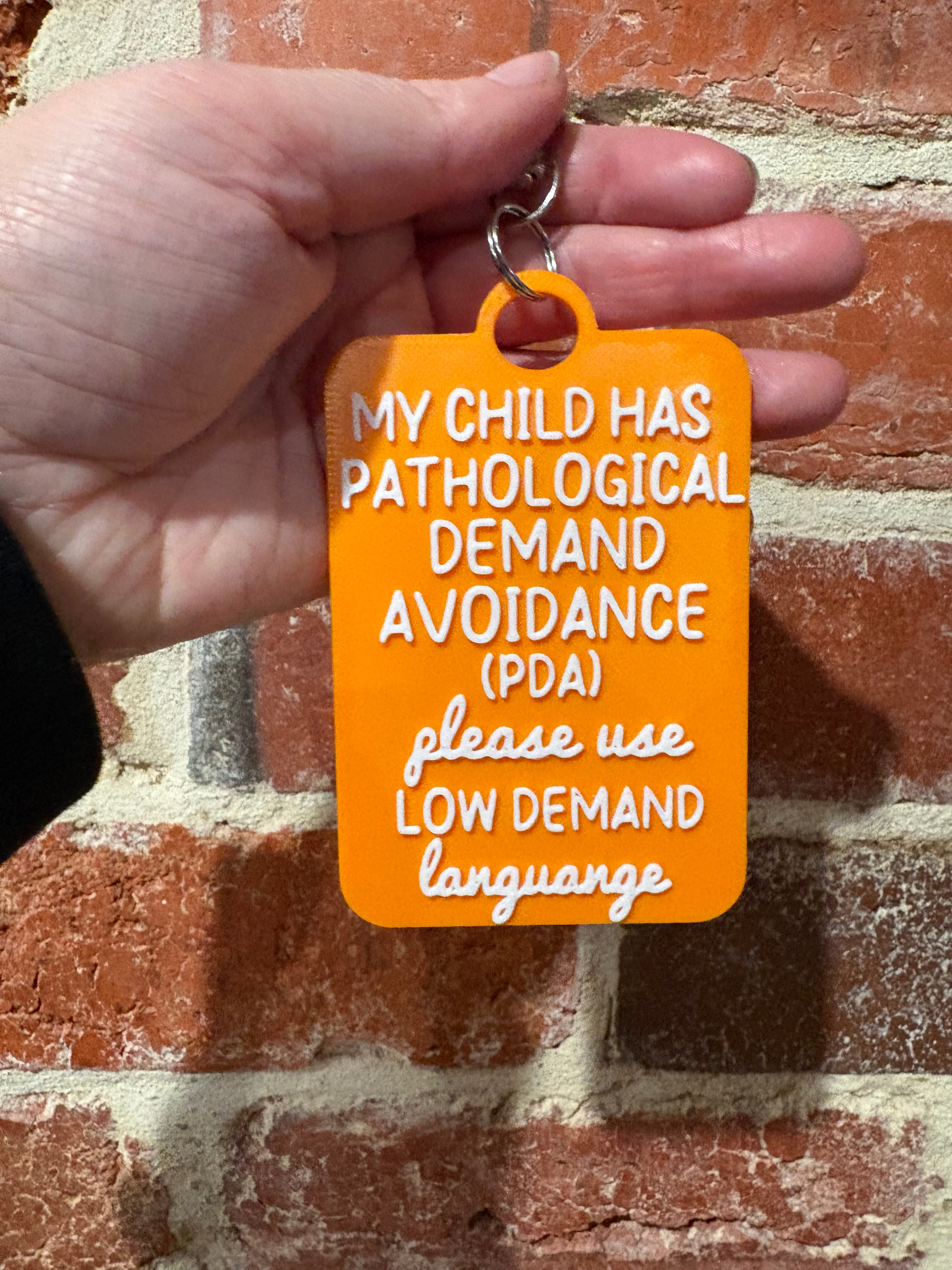 'My Child Has Pathological Demand Avoidance PDA Low Demands' Talkies Awareness Tag - Coloured Background with White Text