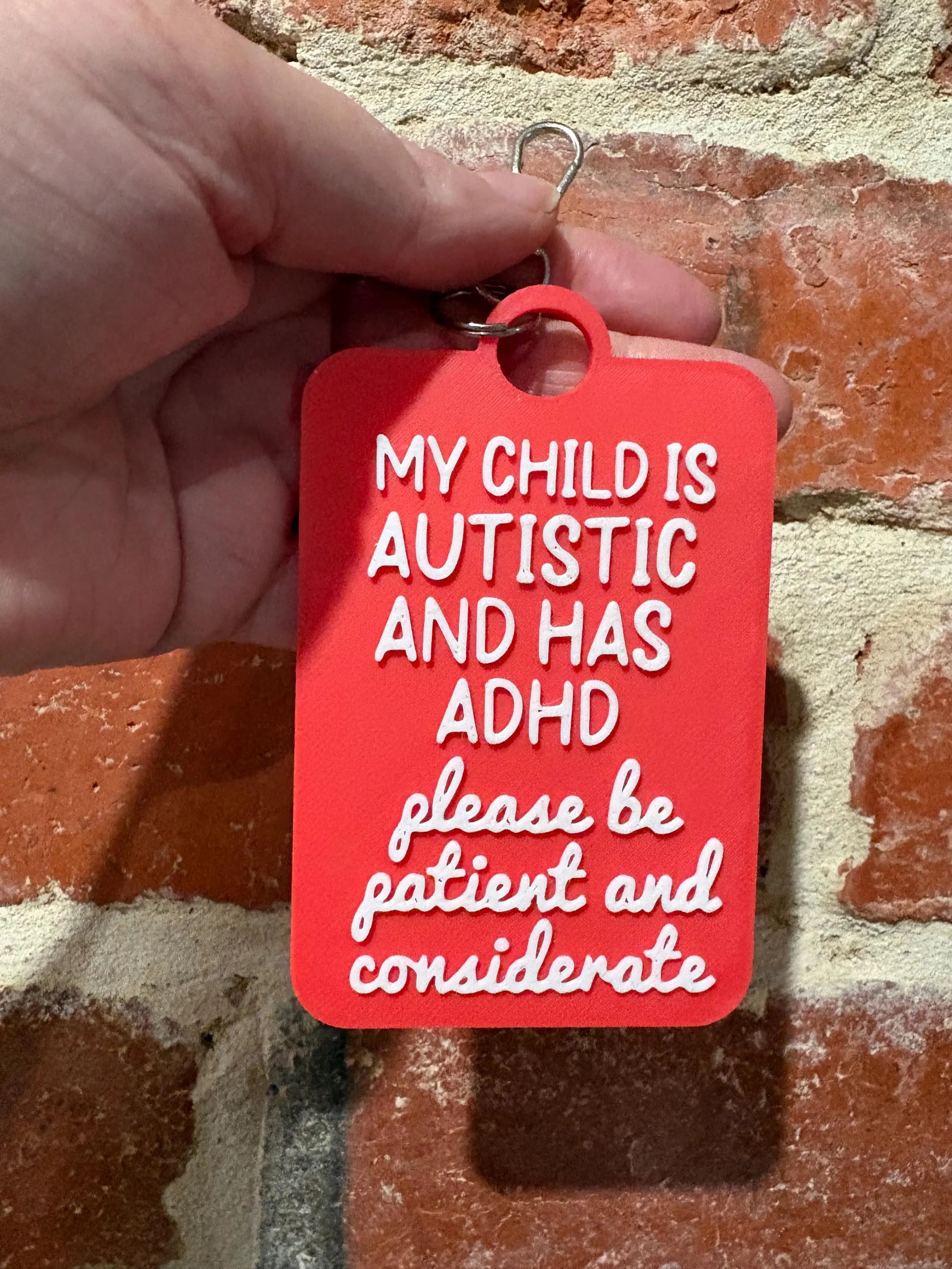 'My Child Is Autistic and has ADHD' Talkies Awareness Tag - Coloured Background with White Text