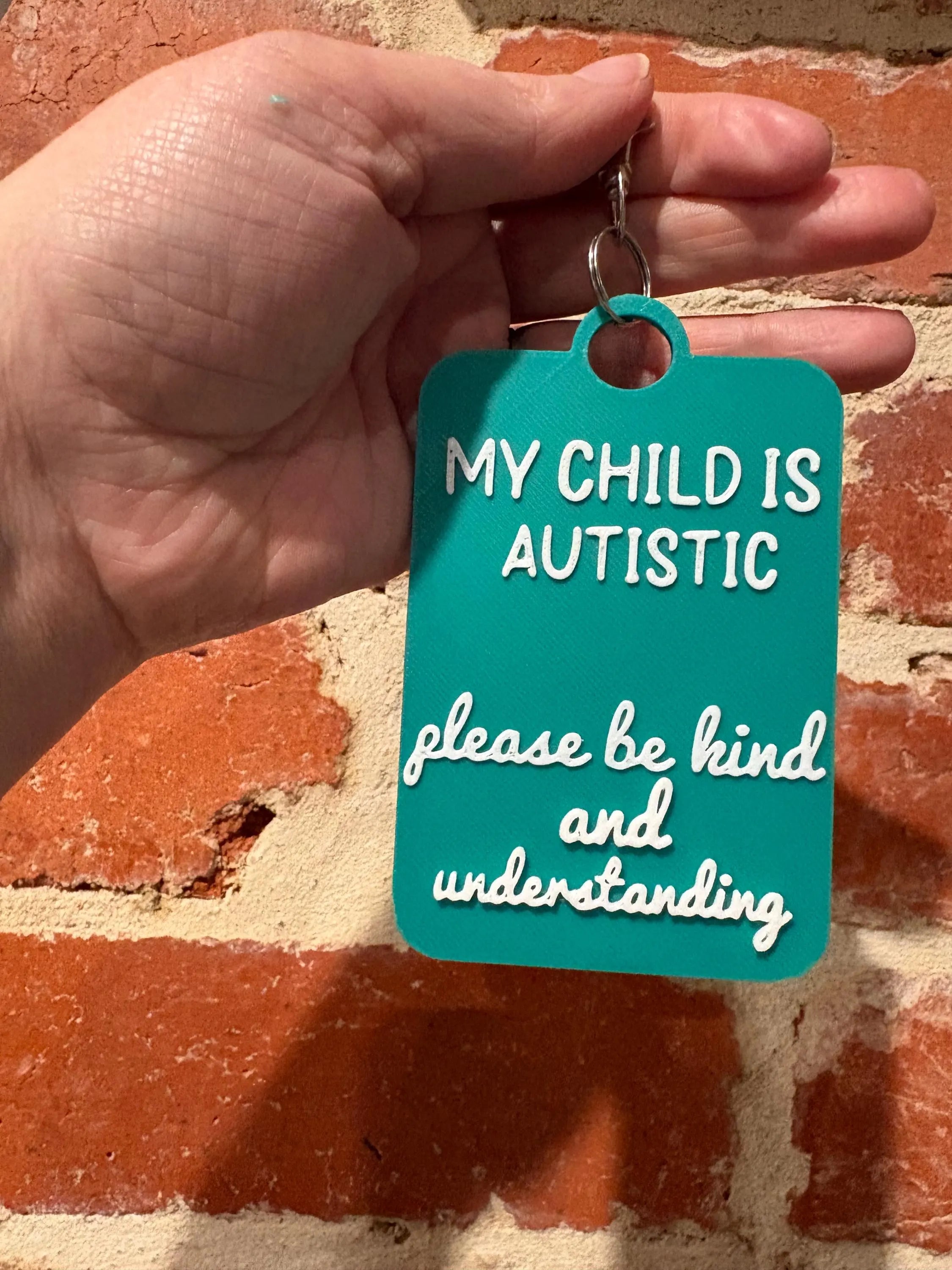 'My Child Is Autistic' Talkies Awareness Tag - Coloured Background with White Text