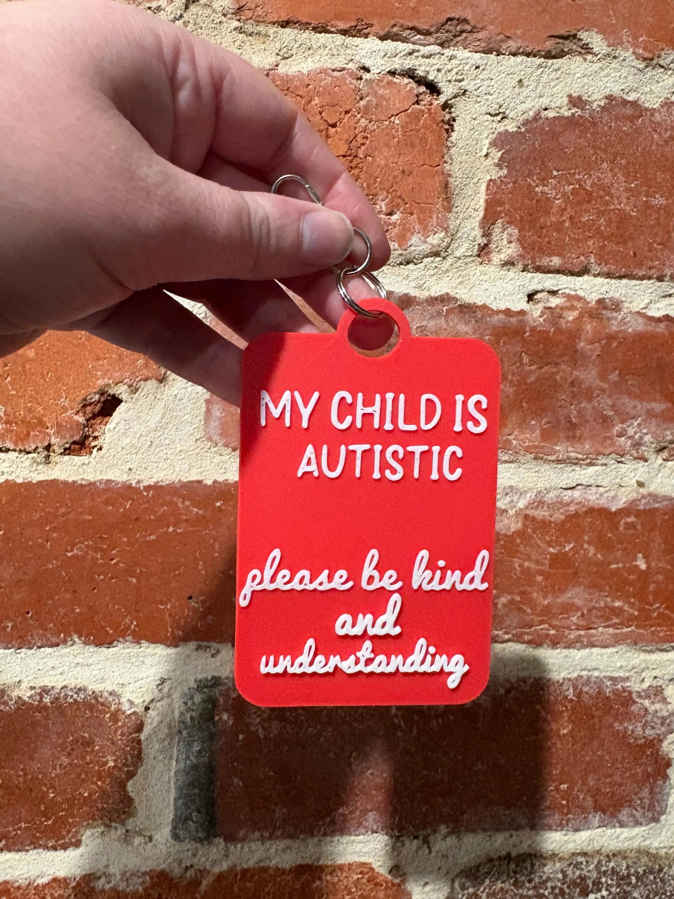 'My Child Is Autistic' Talkies Awareness Tag - Coloured Background with White Text