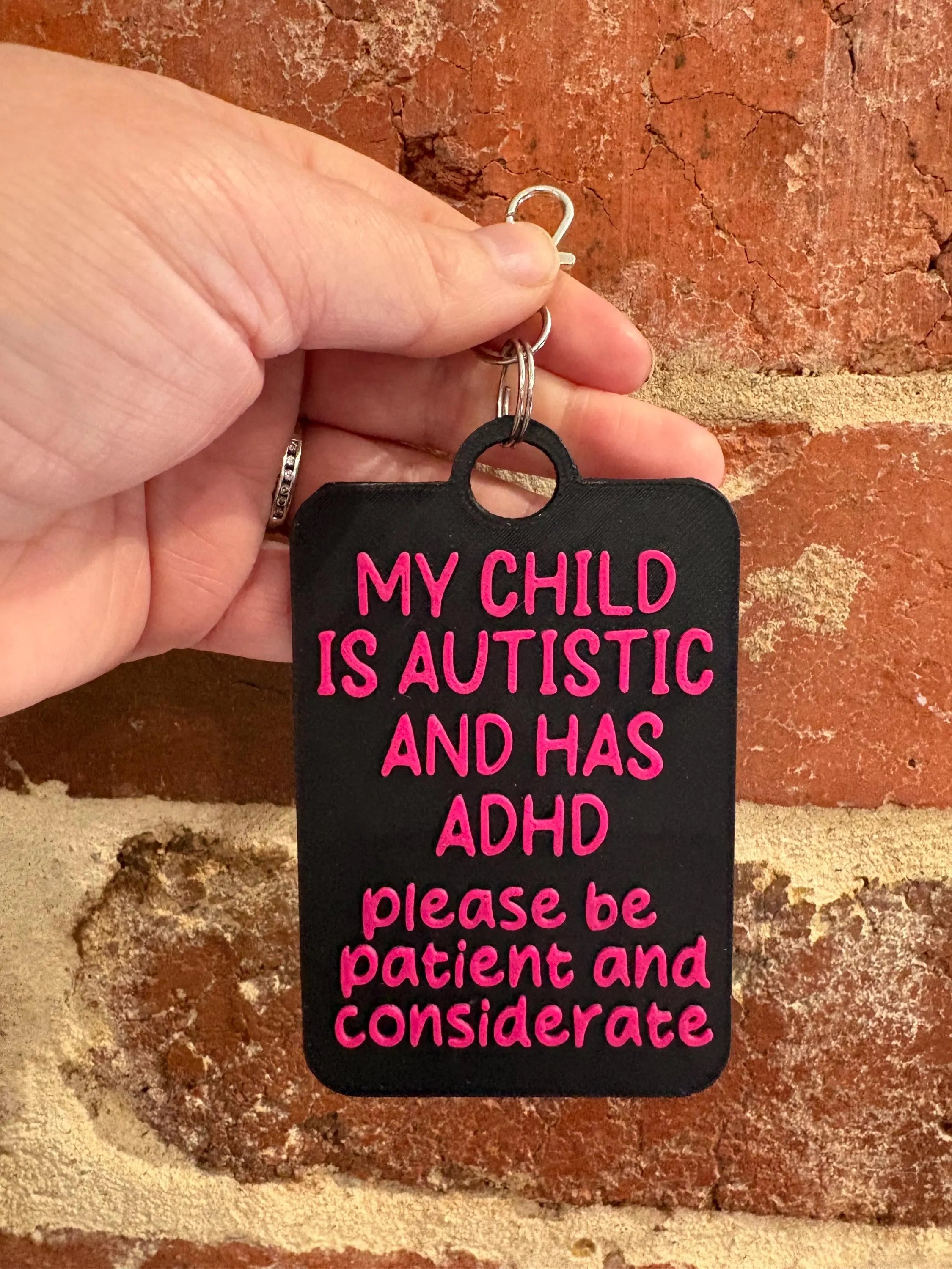 'My Child Is Autistic and has ADHD' Talkies Awareness Tag - Black Background with Coloured Text